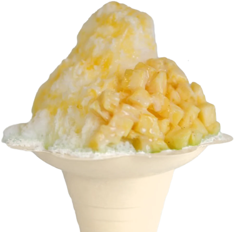 A cup of Nalu shave ice piled with fresh pineapple